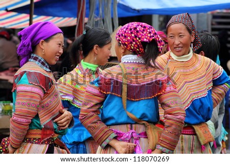 BAC HA, VIETNAM - JUNE 3: Unidentified women of the Flower H\'mong ethnic minority People at market on June 3 2012 at Bac Ha, Vietnam. There are about 800,000 thousand H\'mongs in Vietnam.