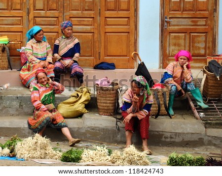 BAC HA, VIETNAM - JUNE 3: Unidentified women of the Flower H\'mong ethnic minority People at market on June 3 2012 at Bac Ha near Sapa, Vietnam. There are about 800,000 H\'mongs in Vietnam.