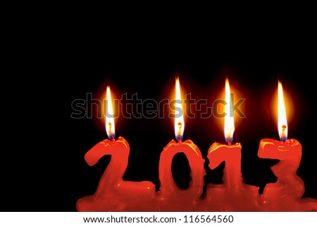 Happy new year 2013, red candles number burning in the dark