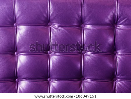 Closeup texture of vintage violet leather sofa for background