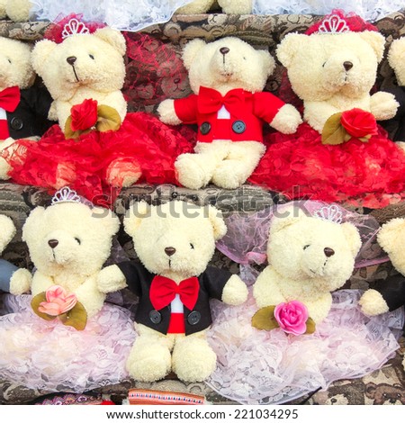 group of teddy bear on shelf in funfair