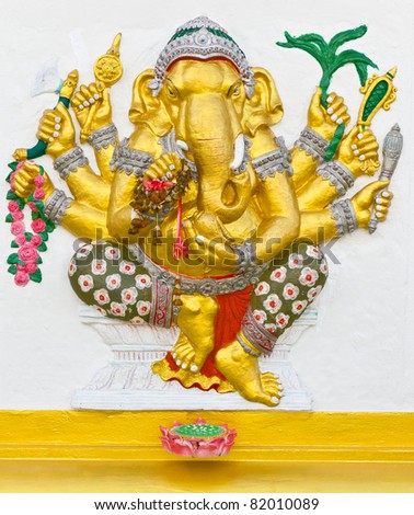 Indian God Ganesha or Hindu God Name Vighna Ganapati avatar image in stucco low relief technique with vivid color,Wat Samarn temple,Thailand.