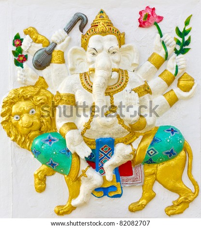 Indian God Ganesha or Hindu God Name Singha Ganapati avatar image in stucco low relief technique with vivid color,Wat Samarn temple,Thailand.