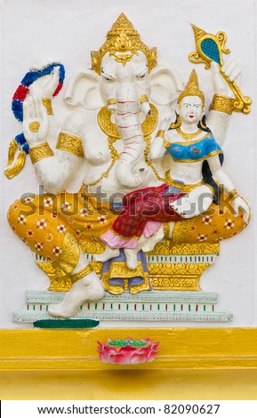 Indian God Ganesha or Hindu God Name Shakti Ganapati avatar image in stucco low relief technique with vivid color,Wat Samarn temple,Thailand.