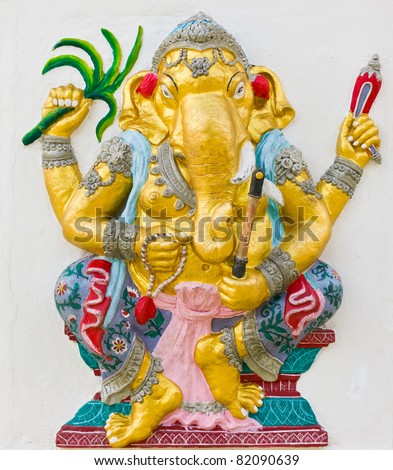 Indian God Ganesha or Hindu God Name Yoga Ganapati avatar image in stucco low relief technique with vivid color,Wat Samarn temple,Thailand.