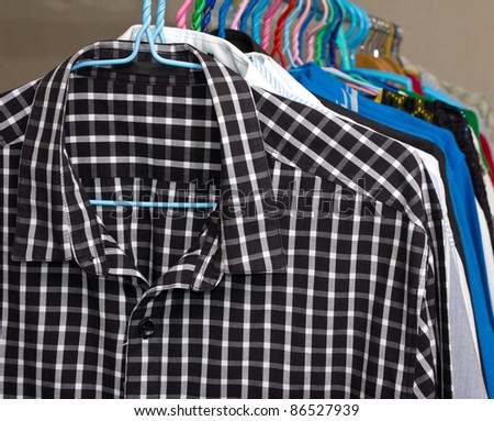 Multi colored shirts on hangers