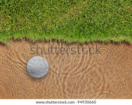 Golf ball drop in water bunker near green grass