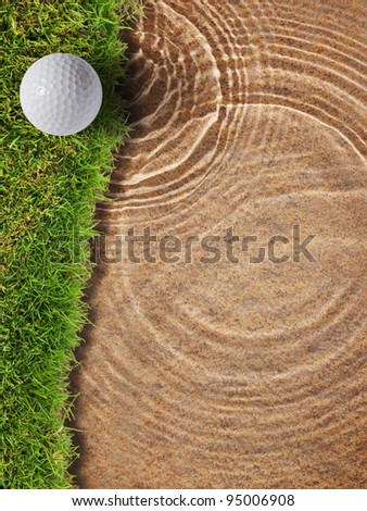 Golf ball on fresh green grass near water bunker in golf course
