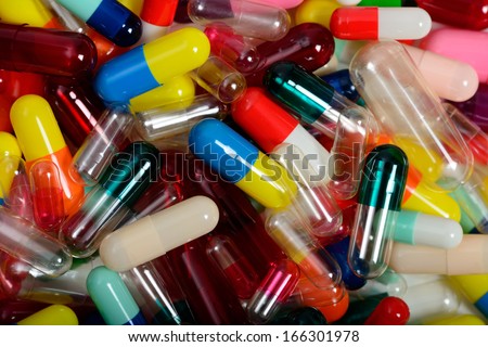 Empty medicinal capsules in varying colors, sizes and styles.