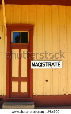 Door to magistrates office in old train station in southern Arizona town.