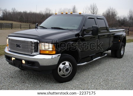 Big black dual rear tire diesel truck.