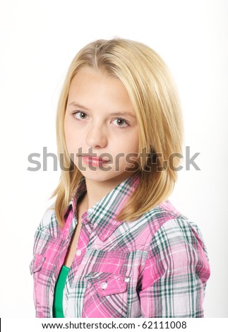 stock photo Young preteen girl with a serious look in studio pre teen