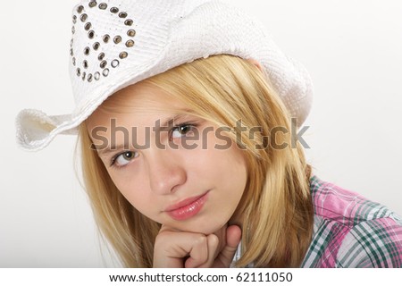 stock photo Young preteen girl with cowboy hat in studio