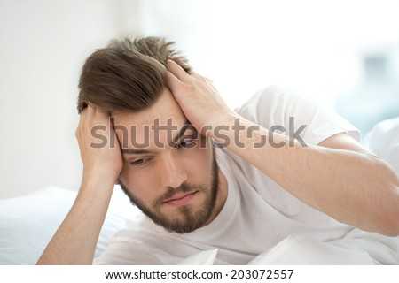 Sad man trying to wake up