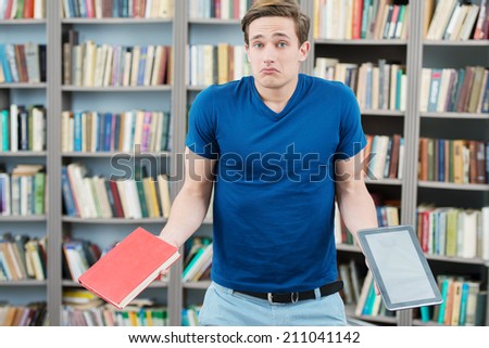 Confused student trying to choose between book and computer