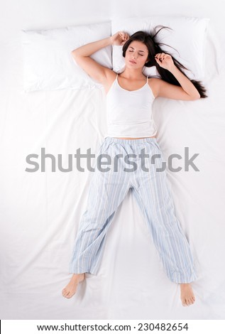 Woman sleeping in free fall position