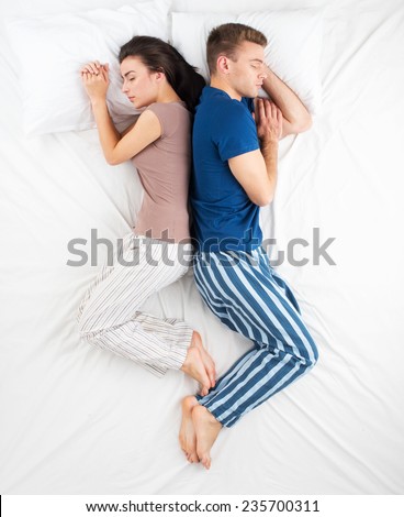 Top view photo of sleeping couple