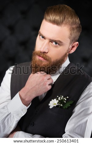 Photo of stylish and bizarre man with beard. Concept for modern hipster