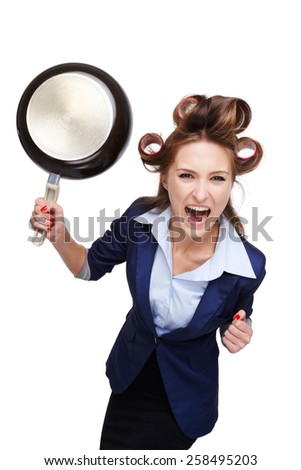 Funny picture of young business woman with curler. Woman screaming at camera and holding pan. Isolated on white background