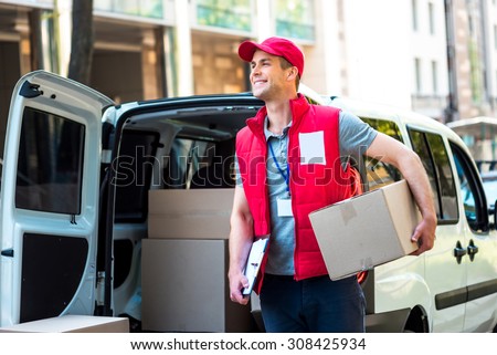 Courier Delivering Package By Van
