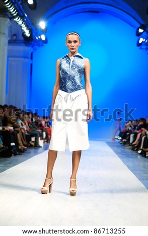 KIEV, UKRAINE - OCTOBER 14: Fashion model wears clothes created by \