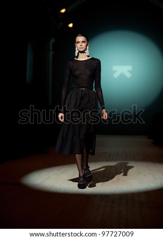 KIEV, UKRAINE - MARCH 15: Fashion model wears clothes created by \