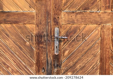 old wooden door with vintage door handle