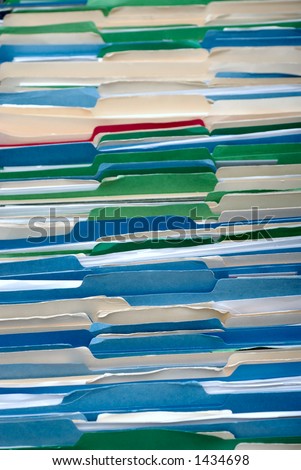 Messy Filing Cabinet with Multicolored File Folders