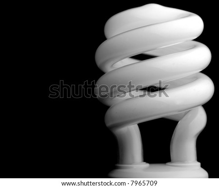 Close-up of a compact fluorescent light (CFL) bulb on black background