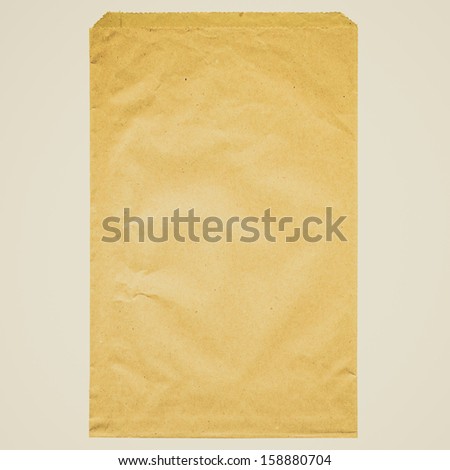 Paper bag for food such as vegetables and bread - isolated over white background
