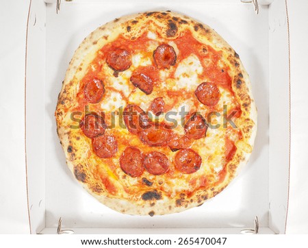 Pepperoni pizza aka diavola traditional Italian pizza in a carton box