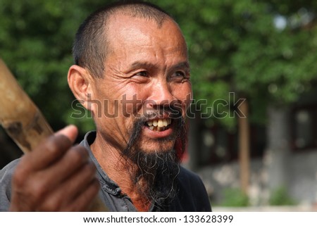 GUANGXI - JUNE 18: Chinese man in Guangxi region, traditional type of man face in China, June 18, 2012 in Guangxi, China. The average life expectancy among Chinese men is 72 years