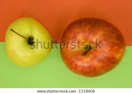 two apple on background green and red colors