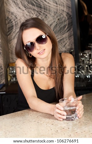 Beautiful fashion model in a bar