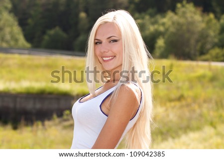 Young pretty blond model smiling
