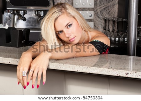 Gorgeous blond lady at a bar table