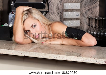 Adult blond model at bar table