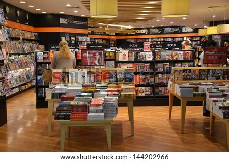 SINGAPORE-JUNE 14: Customers shop for books in Changi Airport, Singapore on June 14, 2013. Singapore airport provides the best shopping experience to the passengers.