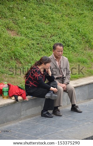 GUILIN, CHINA - MARCH 24: Chinese old couple rests on the road side on March 24, 2012 in Guilin, China. Within a few years China will have more old people than any other country.