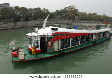 GUILIN, CHINA - MARCH 31:The motor boat travels on the Li River on March 31, 2012 in Guilin, China. A Li River cruise from Guilin to Yangshuo is one of the most popular activities in a Guilin holiday.
