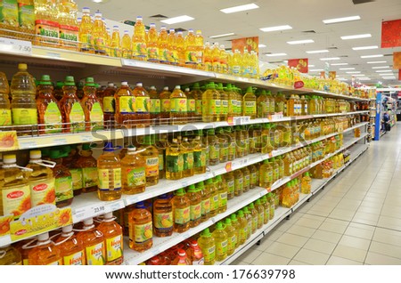 JOHOR, MALAYSIA - FEBRUARY 10, 2014: Various brands of cooking oils on the rack of supermarket. Majority of Malaysian use palm oil for the dairy meal.