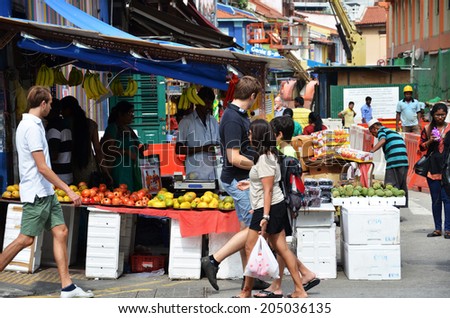 SINGAPORE - 11 JULY, 2014: Unidentified people shop at a grocery shop in Little India. Indian is the third largest ethnic group after Chinese and Malay in Singapore.