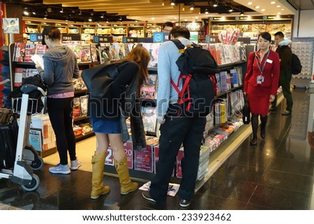 HONG KONG- NOVEMBER 22: Customers shop for books on 23 November 2014 in Hong Kong Airport. Hong Kong airport provides the best shopping experience to the passengers.