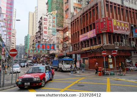 HONG KONG - NOV 19: Taxi and unidentified people near Mong Kok metro station on November 19 2014. Over 90% daily travelers use public transport. Its the highest rank in the world.