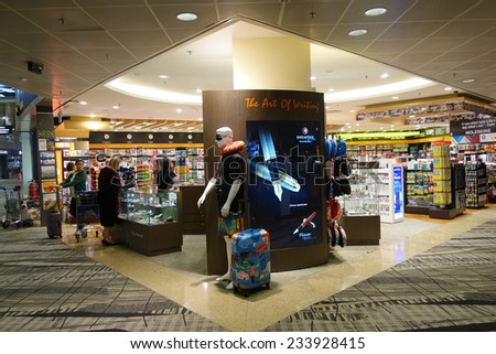 SINGAPORE- NOVEMBER 19: Customers shop for books on 19 November 2014 in Singapore Airport. Singapore airport provides the best shopping experience to the passengers.