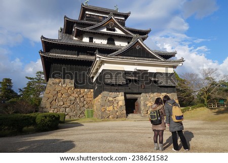 SHIMANE, JAPAN - DECEMBER 06: Tourists visit Matsue samurai feudal castle in Shimane prefecture on December 06, 2014., This castle is also known as Black castle in Shimane prefecture.
