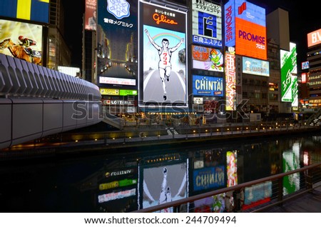 OSAKA, JAPAN - DEC 04 2014: The Glico Man light billboard and other light displays on December 04, 2014 in Dontonbori, Osaka, Japan. Namba is well known as an entertainment area in Osaka.