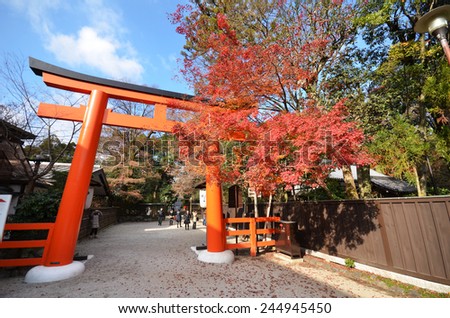 KYOTO, JAPAN - DEC 09: Tourists visit Shimogamo shrine orange archway in Kyoto, Japan on December 09, 2014. Shimogamo Shrine is one of the oldest shrines in Japan and is a World Heritage Site.
