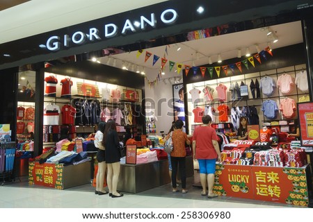JOHOR, MALAYSIA - JAN 20: Customers visit Giordano store to buy cloth on January 20, 2015. It well since 1981 its growth from a manufacturer of casual clothing into a leading international retailer.