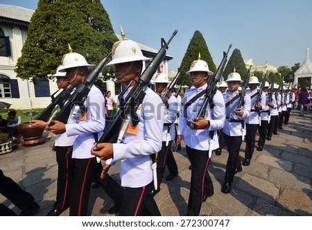 BANGKOK, THAILAND - MAR 27, 2015: Kings Guards are marching in Grand Royal Palace in Bangkok, Thailand on March 27, 2015. Palace was the residence of Siam Kings, now used for official events.